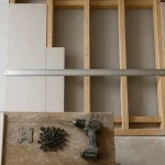 Ossature bois placo : vissage pour limiter les fissures